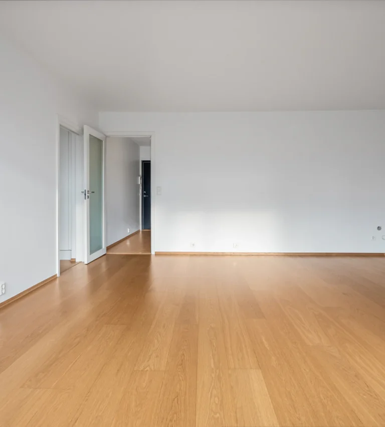 Empty, freshly cleaned apartment with wood floors