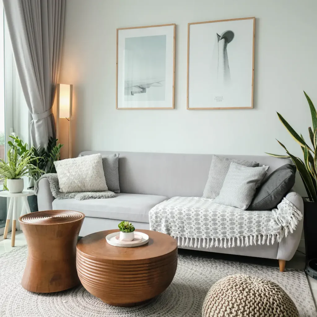 Tidy living room with a light gray sofa and fresh plants